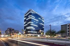 Adaptation Living LLC — Bank of America Building, Uptown Phoenix at night